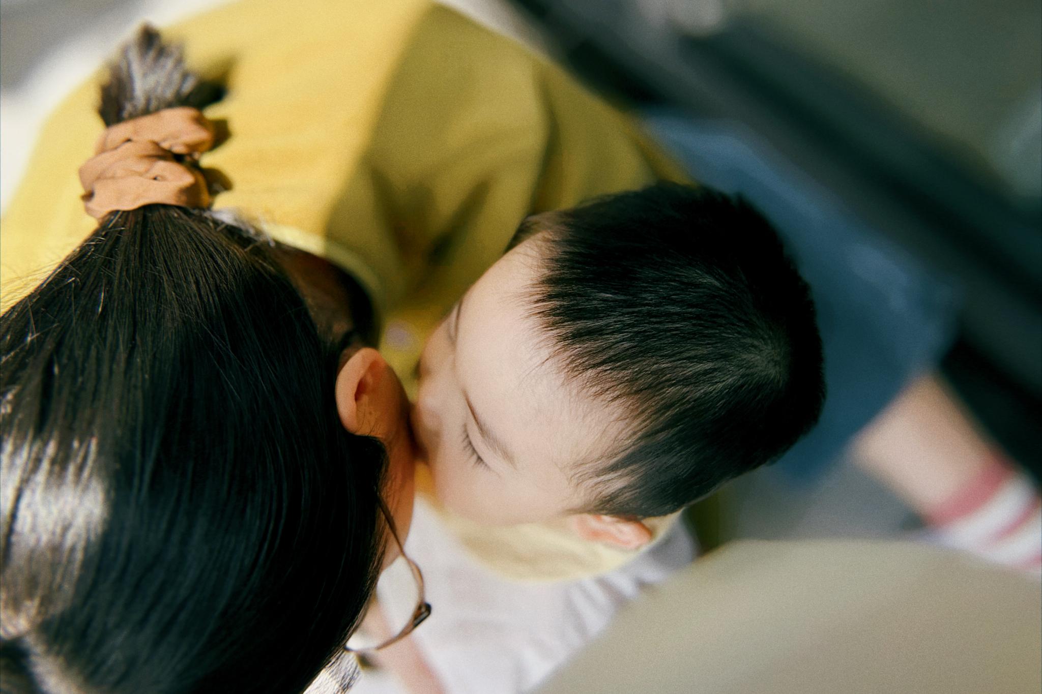 A close-up of two people kissing