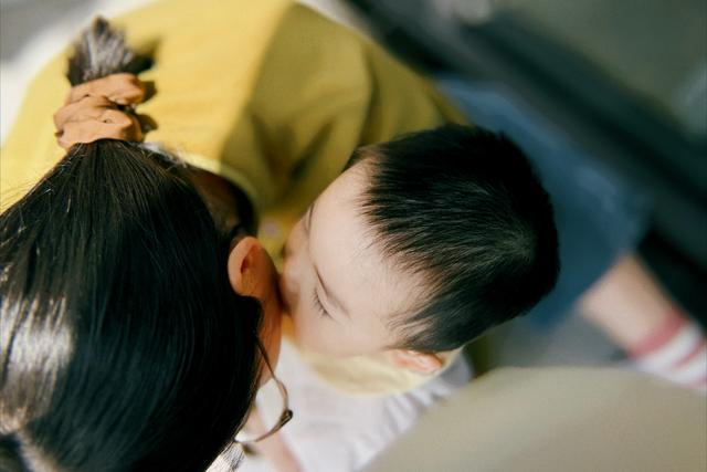 A close-up of two people kissing